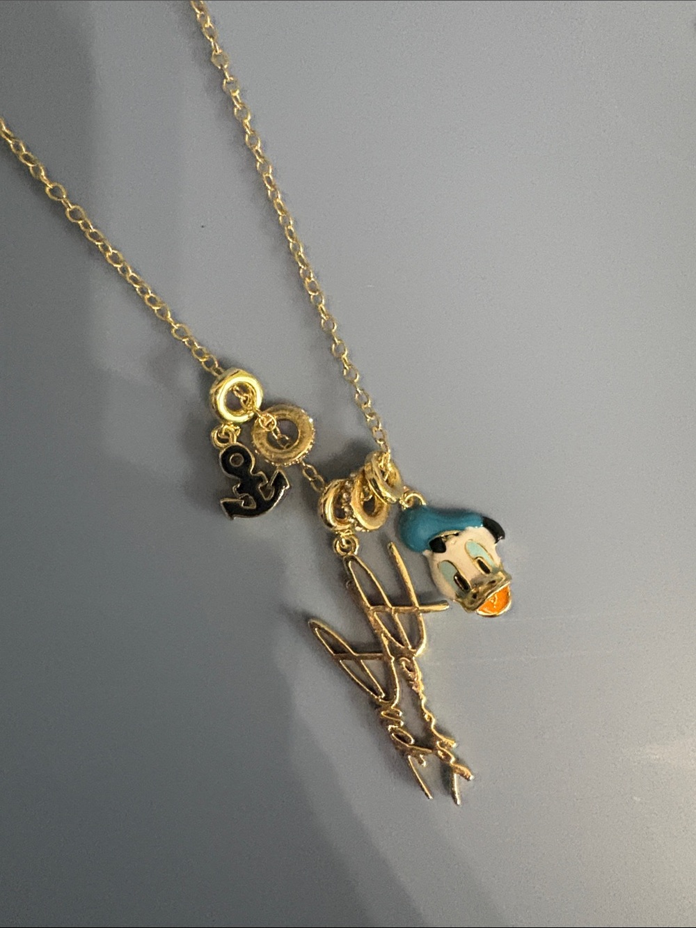 BaubleBar Gold-Tone Donald Duck Charm Necklace with Blue and Orange Accents